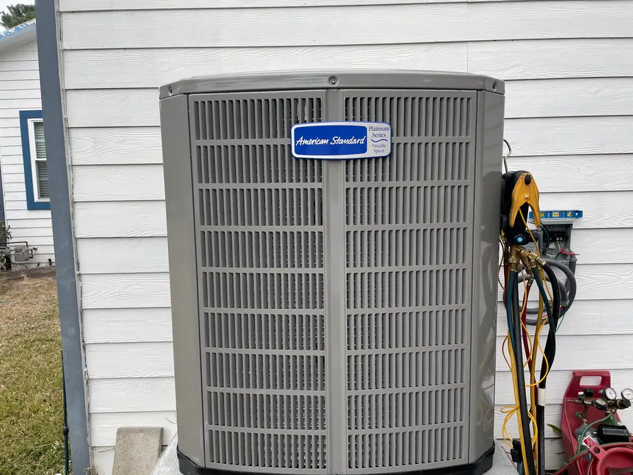American Standard Platinum Series condenser with manifold gauges and charging hoses attached
